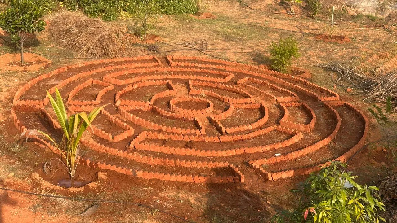 Mandala garden design with brick spiral pattern